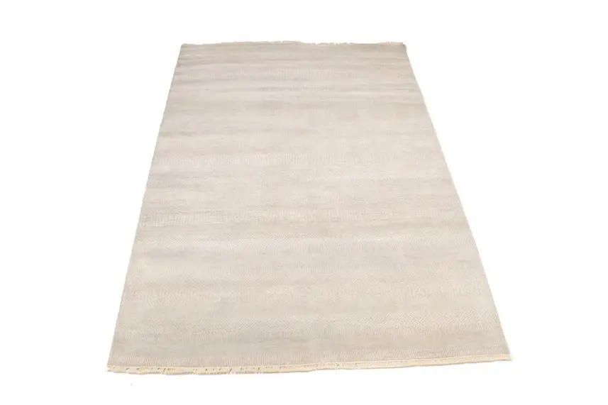 A white rug on a white background  Description automatically generated