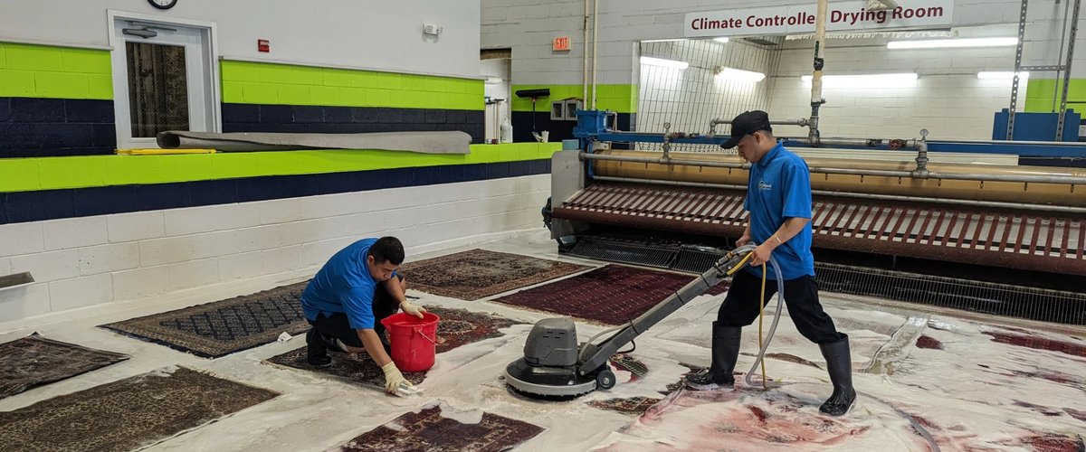 Magic Rugs team hand-cleaning area rugs in the workshop