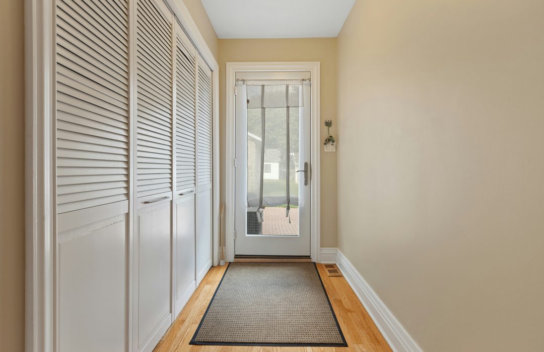 A hallway with a runner rug
